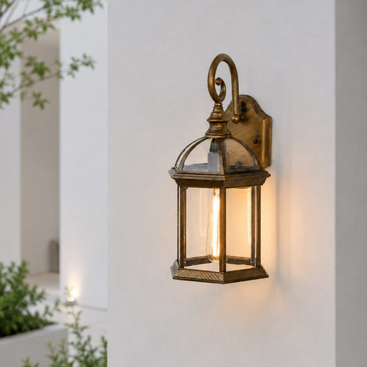 Vintage brass metal outdoor wall lantern for porch entrance patio and exterior walls with warm ambient lighting.