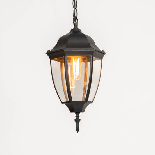 Elegant black metal hanging lantern light with warm ambient glow for modern porch decor.