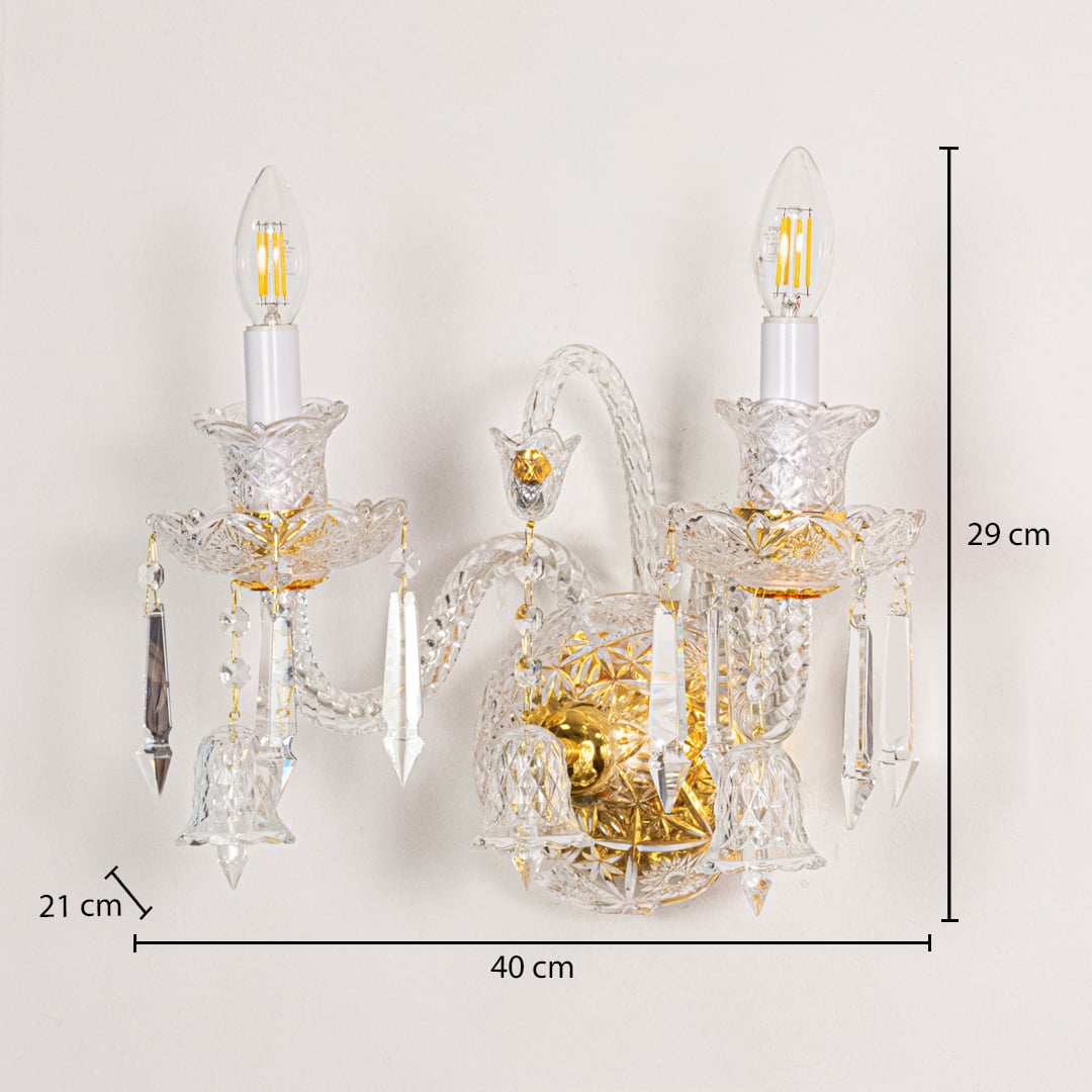 Gold and clear crystal wall light sized 29 cm height and 40 cm width with 21 cm depth ideal for elegant hallway or living room walls.