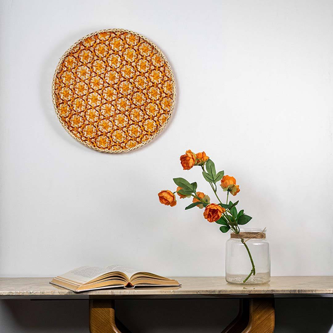 Handcrafted orange and natural seagrass wall basket for living room shelf and modern boho home décor styling.