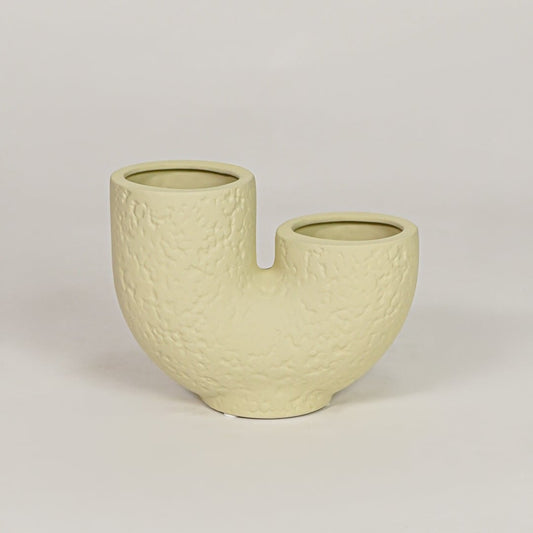 bandsaw textured ceramic vase light green white background