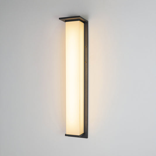 Black metal LED wall light on white background with frosted glass shade for minimalist modern decor.