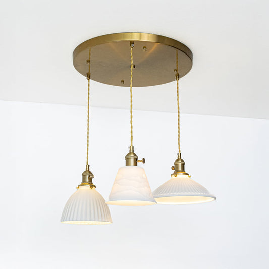 White metal pendant lights with gold accents showcasing stylish designs for contemporary home decor.