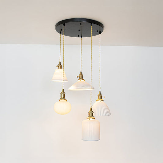 White glass and gold metal pendant lights showcasing refined designs for stylish home decor spaces.