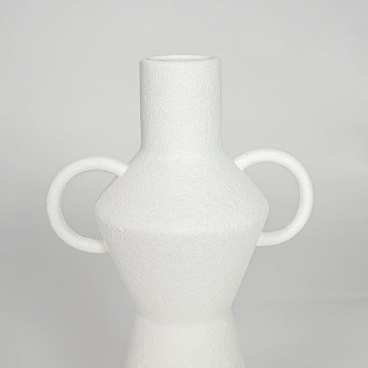 Closeup white ceramic textured decorative vase detail modern tall flower vase for table shelf console decor.