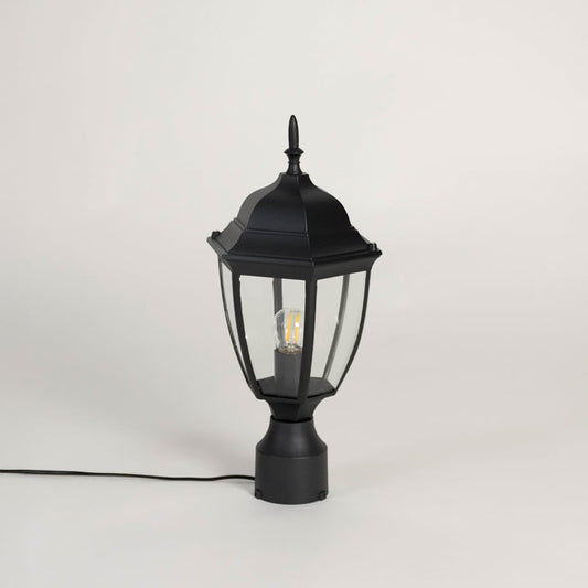 Stylish black outdoor pillar lamp with transparent glass panels designed for modern patio garden and balcony lighting.