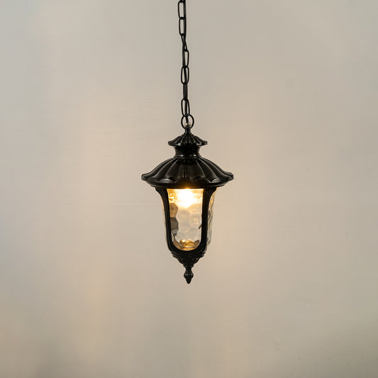 Closeup of black metal outdoor hanging lantern with glass panels on white background ideal for gate entrance and exterior decor lighting.