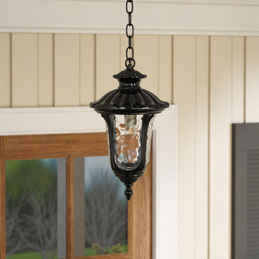 Decorative black metal hanging lantern light enhancing modern porch entryway with warm ambient glow.