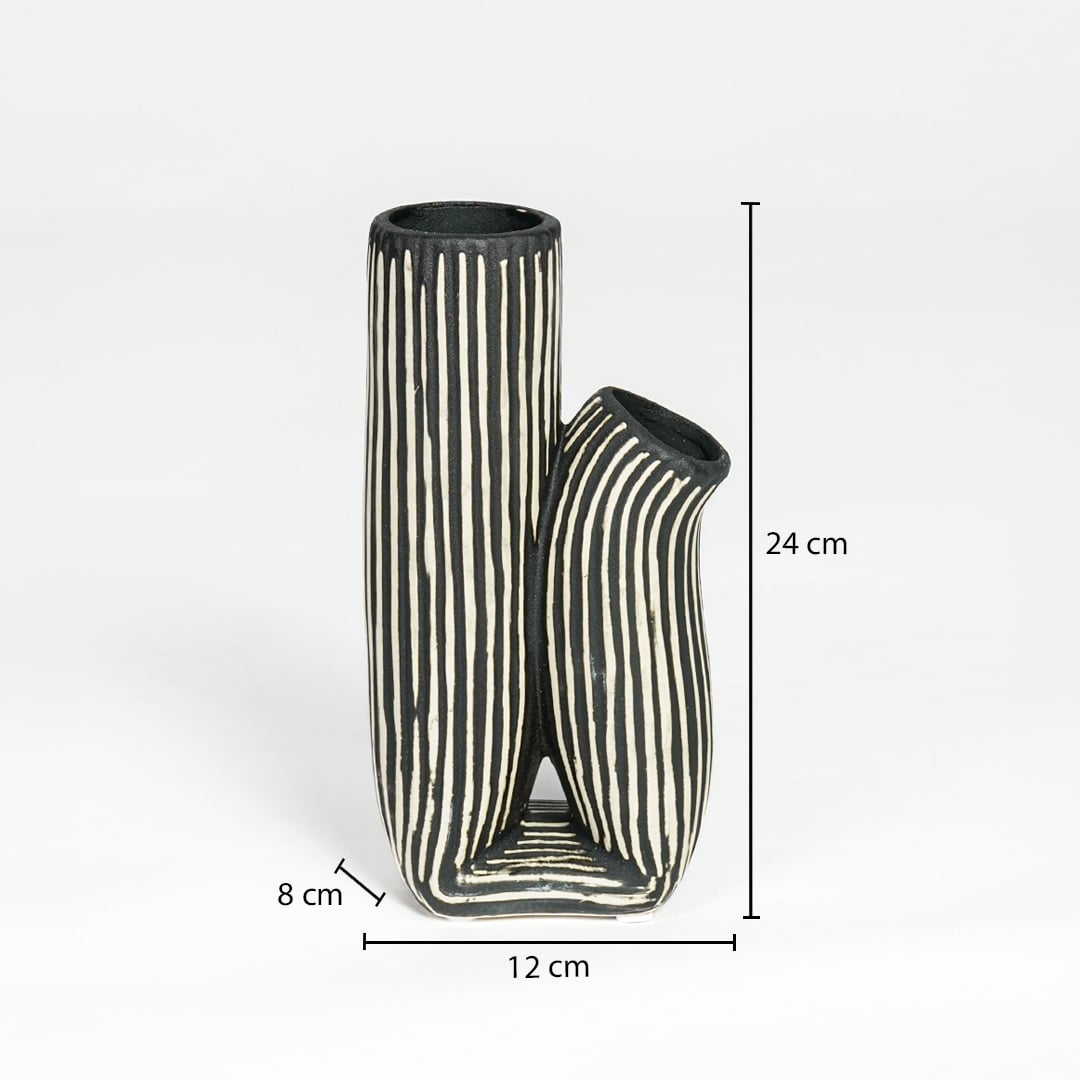 Black and white striped ceramic vase measuring 24 cm height 12 cm width and 8 cm depth ideal for modern decor styling.