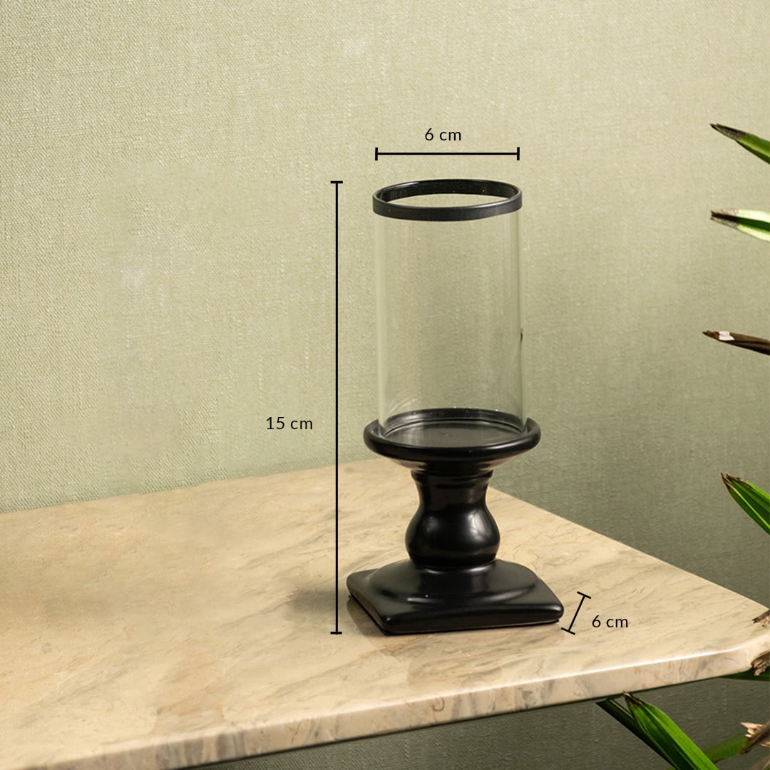 Dimension image of black metal candle holder with clear glass hurricane showing 15 cm height and 6 cm width.