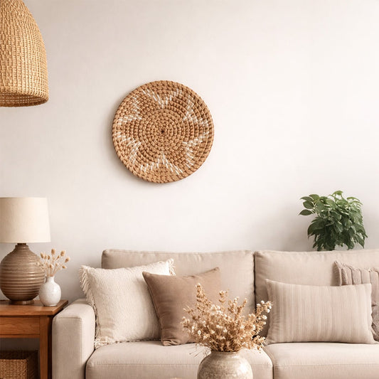 Natural woven wall basket displayed above a sofa for warm bohemian wall decor and contemporary home interiors.