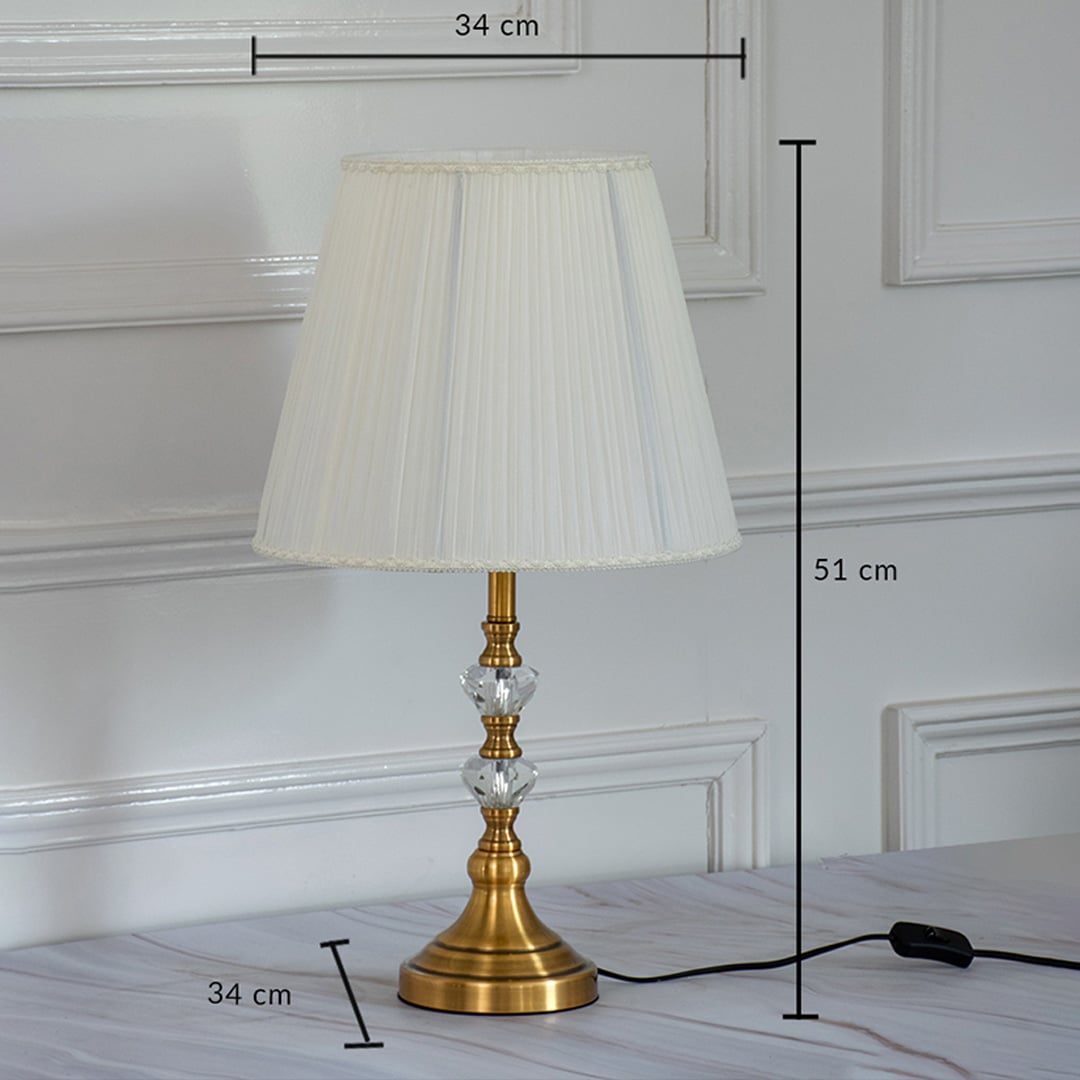 Classic table lamp with gold metal base and white fabric shade showing 51 cm height and 34 cm shade width for tabletop placement.