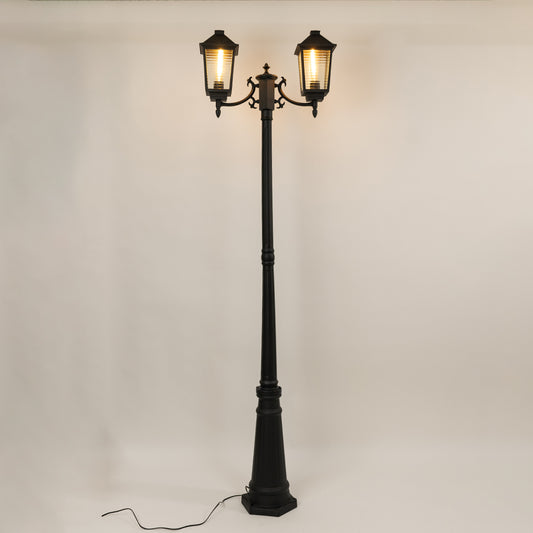 Vintage outdoor street lamp with dual glowing lanterns for elegant exterior decor styling use.