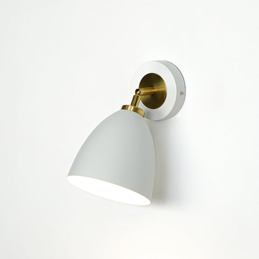 Modern white and gold metal wall light mounted on white wall for elegant bedroom hallway and living room decor.