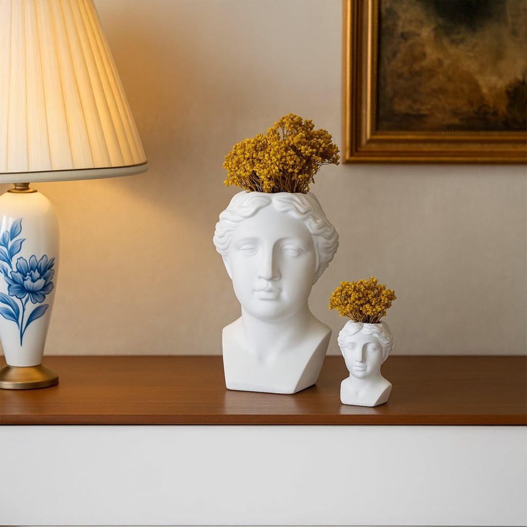 White artistic bust decor piece styled on modern white steps adding a sculptural elegant accent ideal for contemporary and minimalist interiors.