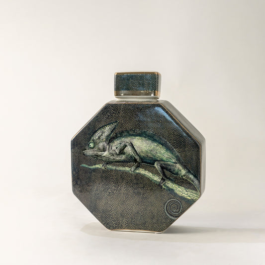 Green ceramic decorative jar with textured glaze and geometric form for elegant tabletop styling and home decor.