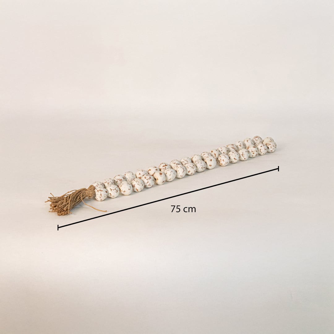 Speckled bead garland measuring 75 cm long ideal for tabletop console or shelf styling in modern interiors.