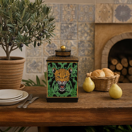 Black ceramic jar with golden leopard design adding bold luxury to a rustic dining table decor.