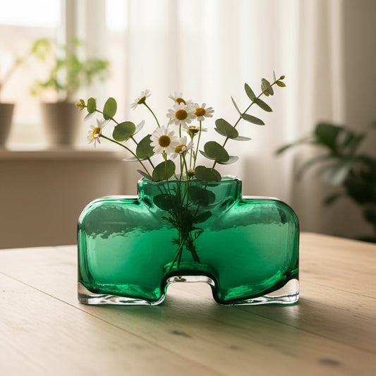 Green art glass vase styled on living room table modern decorative glass accent for console shelf or center table styling home.