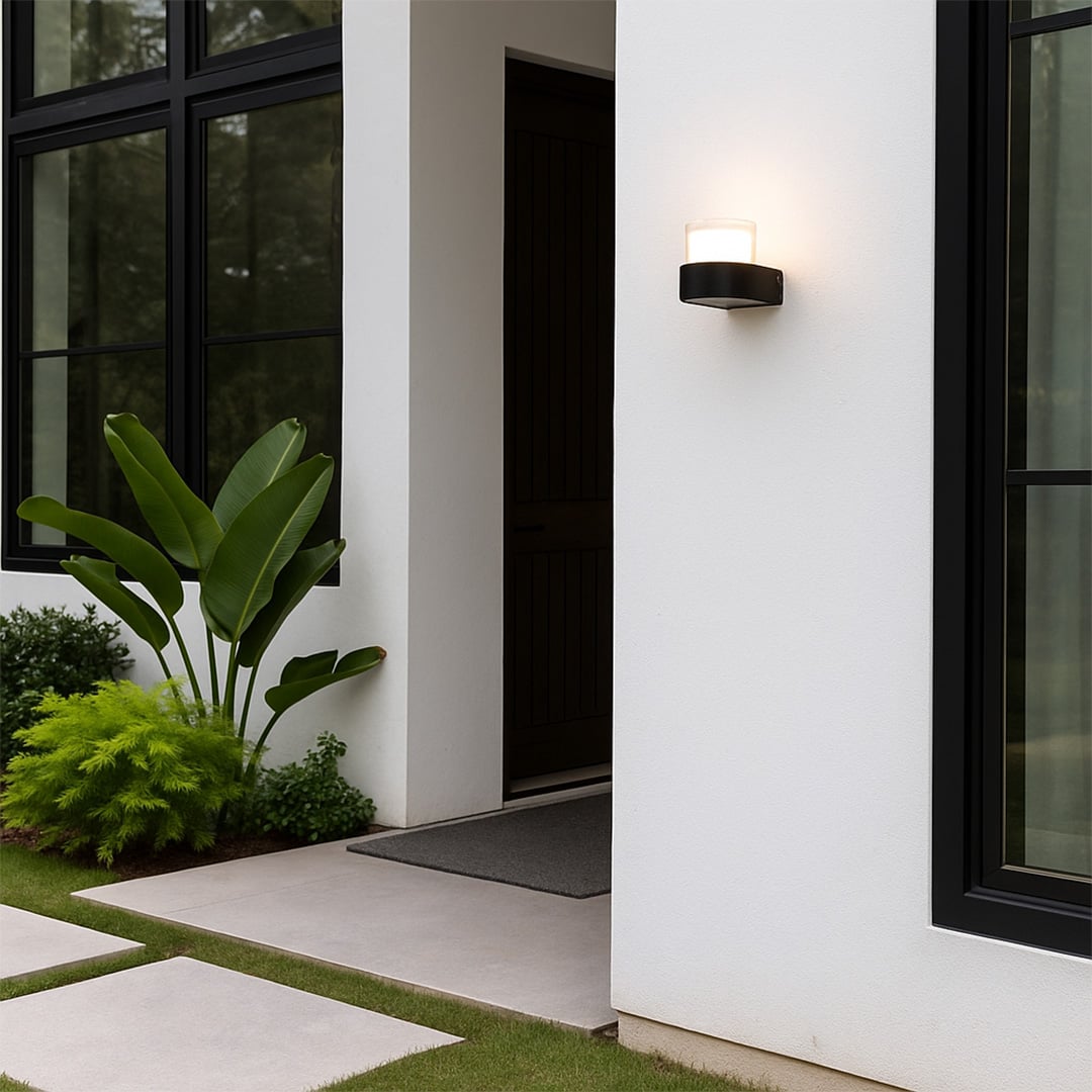 Contemporary wall light adding a subtle glow to minimalist interiors featuring a compact cylindrical design for modern homes.