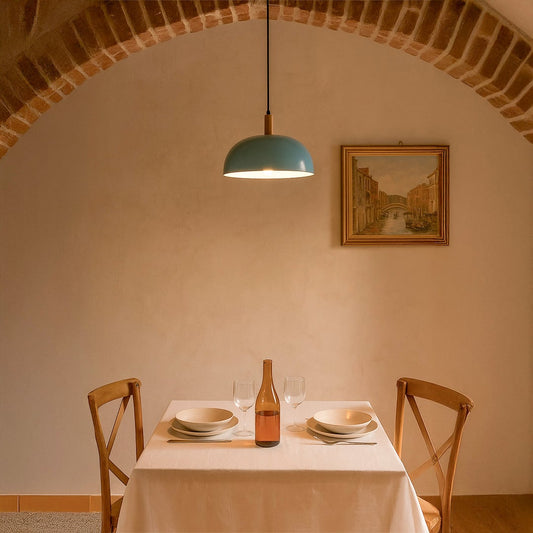 Blue pendant light styled in a rustic dining area with arched brick ceiling wooden chairs and a minimal dining setup creating a modern hanging lamp look for warm ambient lighting.