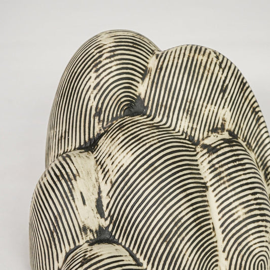 Textured beige ceramic decor sculpture closeup modern decorative showpiece for table console shelf home decor styling.