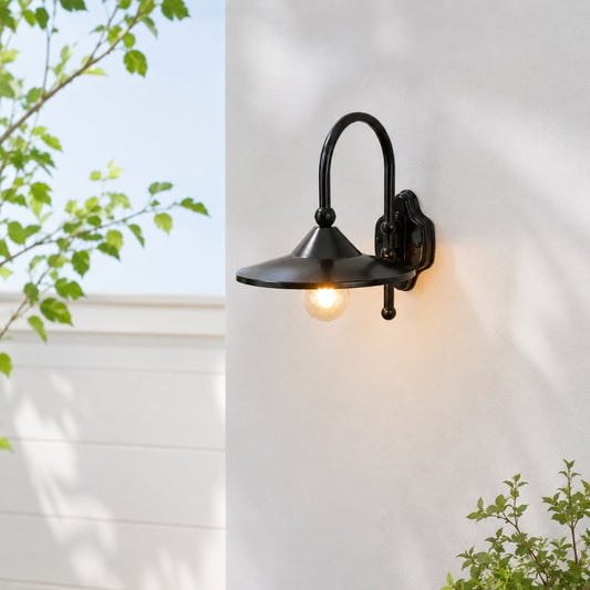 Black metal outdoor wall light with curved arm for porch entrance garden and exterior walls with warm ambient lighting.