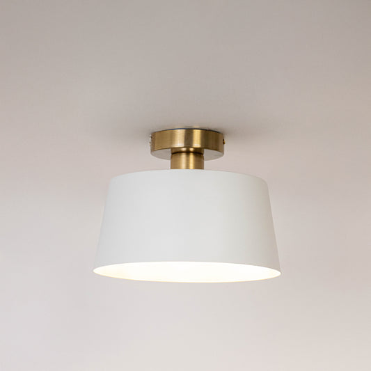 Modern white metal ceiling light with soft illumination for elegant hallway and minimalist home decor spaces.