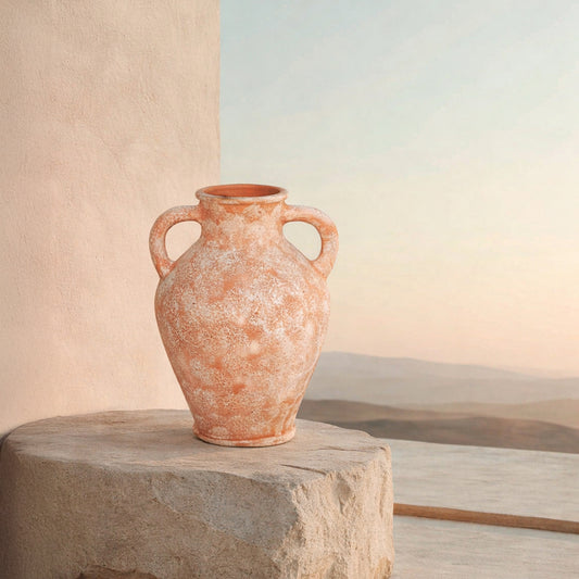 Lifestyle image of peach ceramic handle vase for modern outdoor decor styling with rustic textured finish.