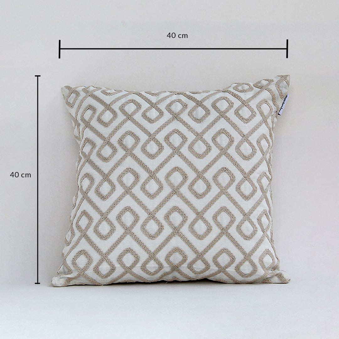 White cotton cushion cover with beige geometric pattern showing product dimensions for accurate size reference and styling.