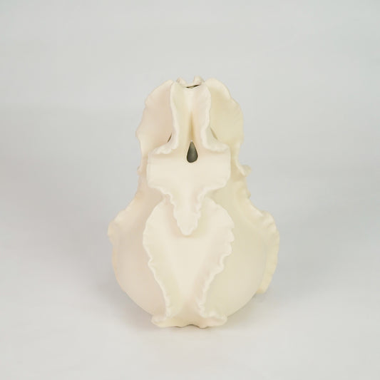 Cream sculptural ceramic vase for elegant coffee table placement and artistic indoor home decor styling accent.