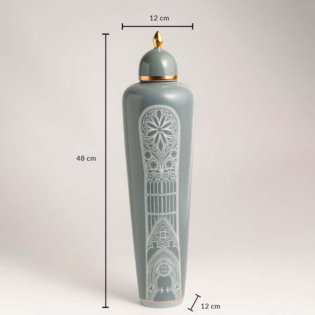 Ceramic jar in green with golden lid and white detailing shown with 48 cm height and 12 cm width dimensions.