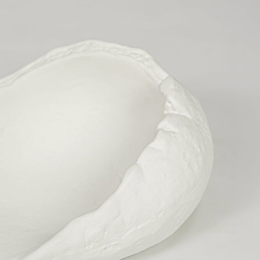 White ceramic decorative bowl with textured finish modern centerpiece bowl for table console living room decor styling.