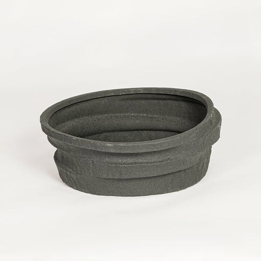 Modern black ceramic decorative serving bowl ideal for fruit display on dining table centerpiece and stylish home decor.