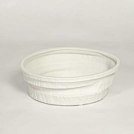 White ceramic round decorative tray with textured rim and smooth interior isolated on clean white background for modern decor styling.