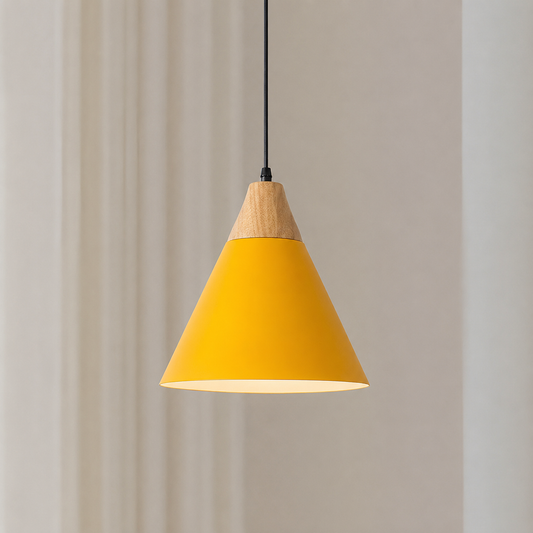 A modern cone-shaped pendant light with a bright yellow shade and a natural wood accent at the top, hanging from a black cord against a soft beige wall.