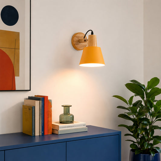 Modern brass metal wall light with orange fabric shade for bedroom hallway and cozy home ambient lighting display.
