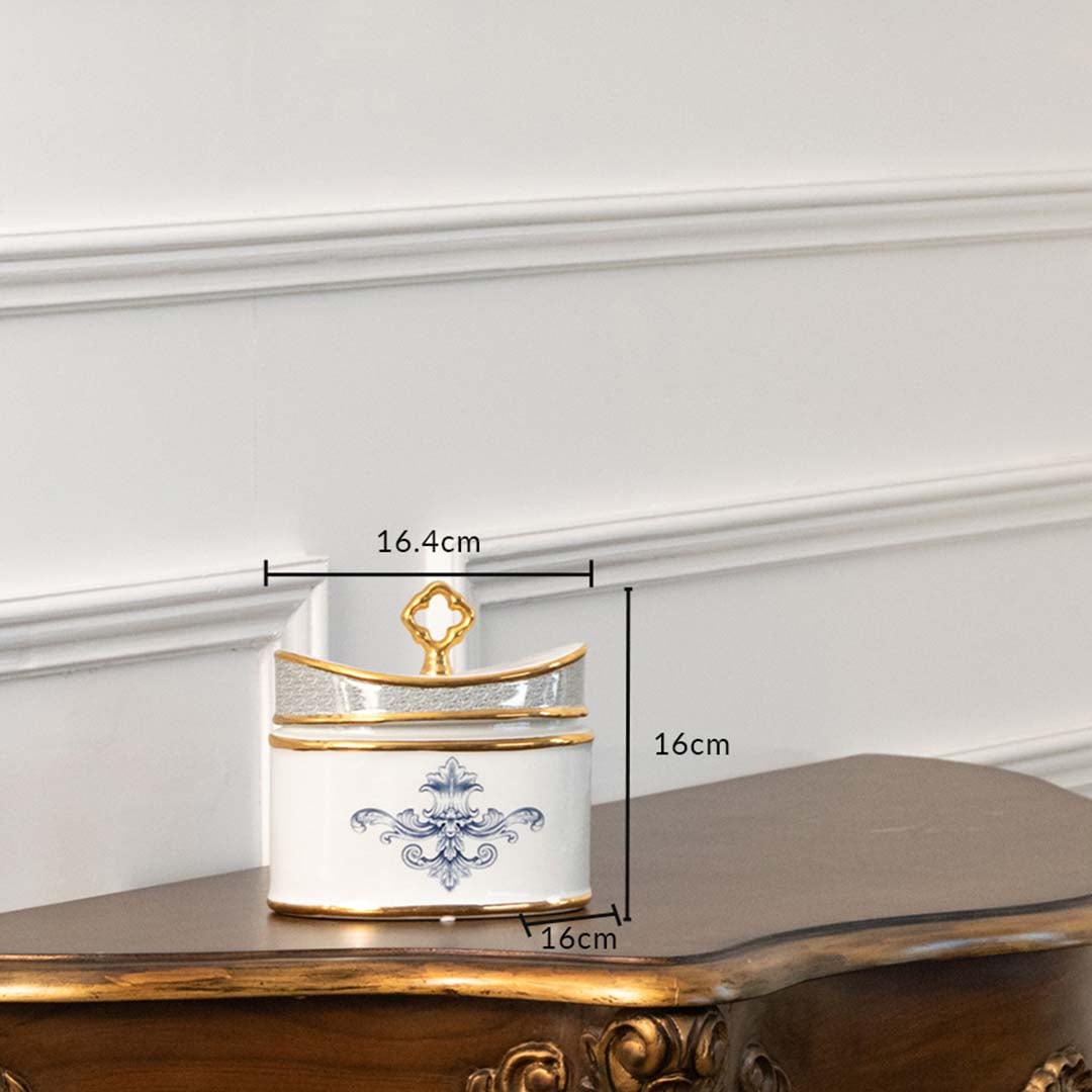 White ceramic jar with blue and gold artwork in a front view measuring 13.5 cm width and 10 cm height ideal for elegant décor styling.