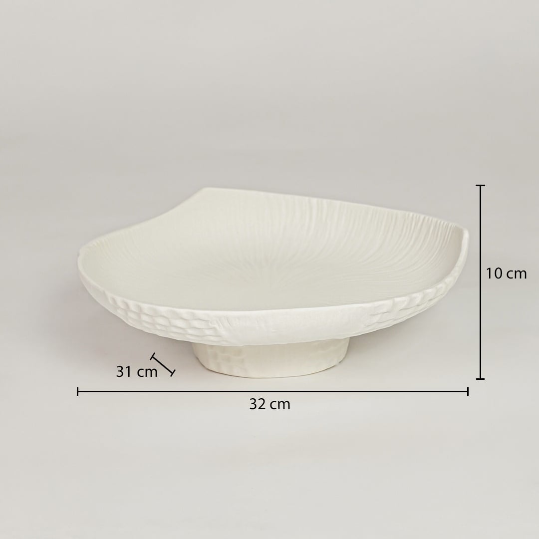 White ceramic pedestal fruit bowl with textured shell design showing 32 cm length 31 cm width and 10 cm height for dining table decor.