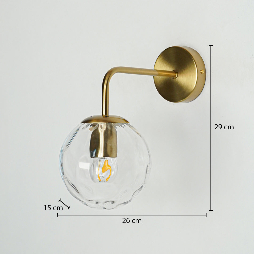 Contemporary brass wall light measuring 29 cm height and 26 cm width for modern interior decor.