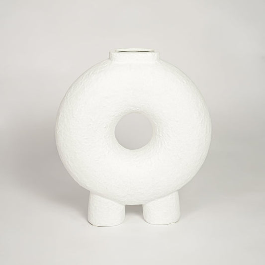 Contemporary white ceramic decorative vase with circular cutout perfect for entryway table living room or dining decor display.