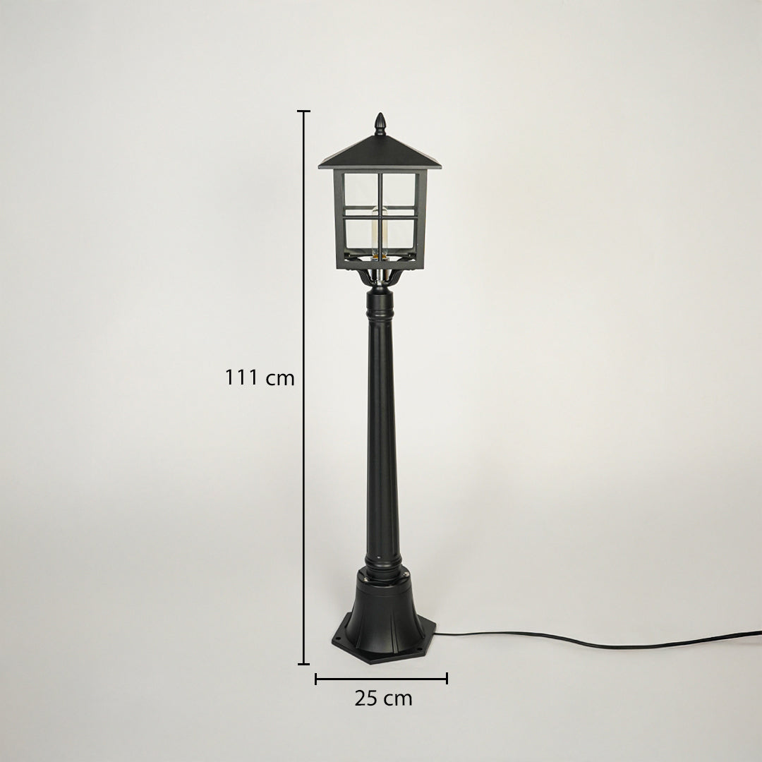 Classic outdoor garden lamp post with black metal body and glass lantern head on neutral background 111 cm height 25 cm base width perfect for pathway lighting.