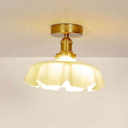 Mint green ruffled ceiling light shown off on a white background with a smooth gold mount.