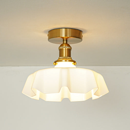 Modern cream glass and gold metal ceiling light for stylish hallway and vintage inspired decor styling spaces.