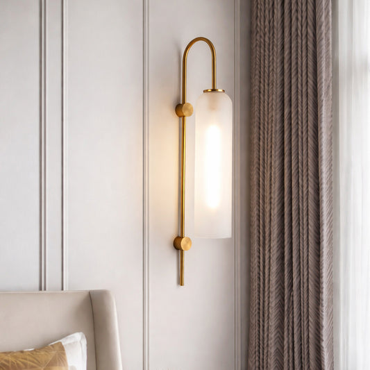 Modern gold metal wall light with frosted glass shade for elegant bedroom and luxury decor styling spaces.