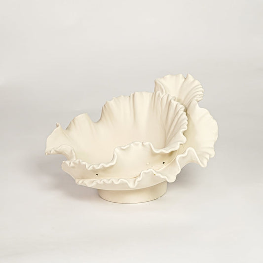 White ceramic ruffled decorative bowl with layered sculpted edges isolated on clean white background for elegant tabletop decor styling.