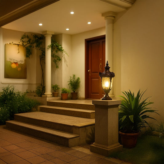 Brown pillar lamp glowing at villa entrance with warm light adding elegant outdoor decor to garden pathway and home exterior.