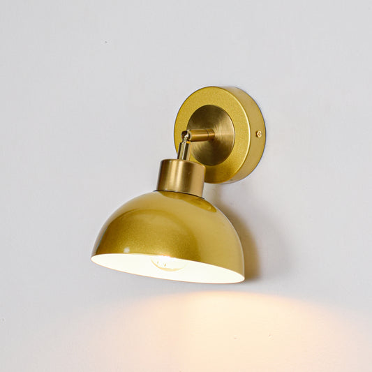 Gold finish wall light with dome shade perfect for modern bedroom or hallway wall decor placement on clean background.