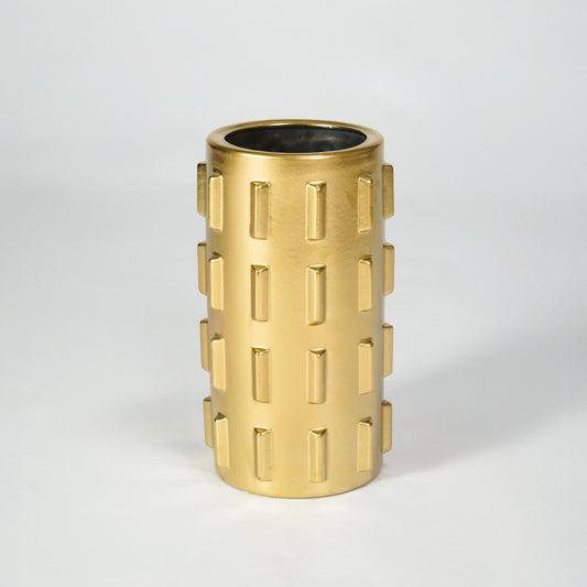 Gold metal planter pot for luxury coffee table placement and modern indoor decor styling accent display piece.