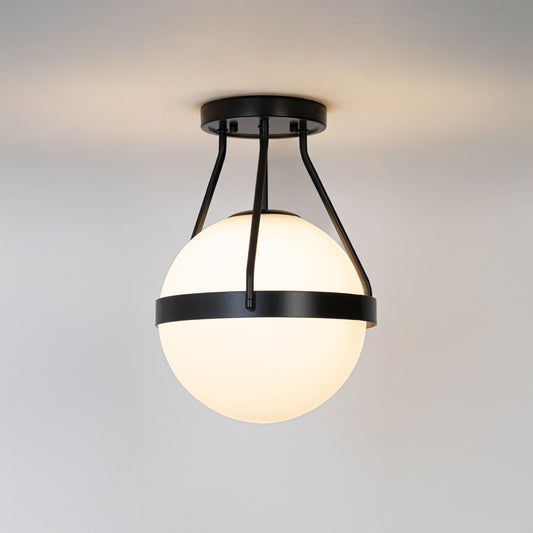 Modern black metal ceiling light with frosted white glass globe for contemporary bedroom and premium decor styling spaces.